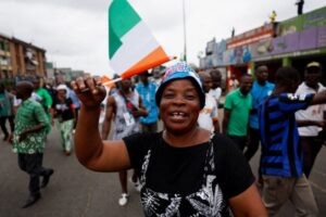 A supporter of coalition parties Democratic Party of Cote d'Ivoire (PDCI) and the African People's Party of Cote d'Ivoire (PPA-CI) protests against the removal of the parties’ leaders from the ballot paper ahead of the presidential election, Abidjan, Cote d'Ivoire, 9 August, 2025. Credit: Luc Gnago / Reuters