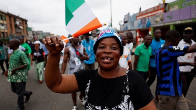Reuters-RC2N3GAORKIC_IVORYCOAST-election-870x580 A supporter of coalition parties Democratic Party of Cote d'Ivoire (PDCI) and the African People's Party of Cote d'Ivoire (PPA-CI) protests against the removal of the parties’ leaders from the ballot paper ahead of the presidential election, Abidjan, Cote d'Ivoire, 9 August, 2025. Credit: Luc Gnago / Reuters