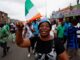 A supporter of coalition parties Democratic Party of Cote d'Ivoire (PDCI) and the African People's Party of Cote d'Ivoire (PPA-CI) protests against the removal of the parties’ leaders from the ballot paper ahead of the presidential election, Abidjan, Cote d'Ivoire, 9 August, 2025. Credit: Luc Gnago / Reuters